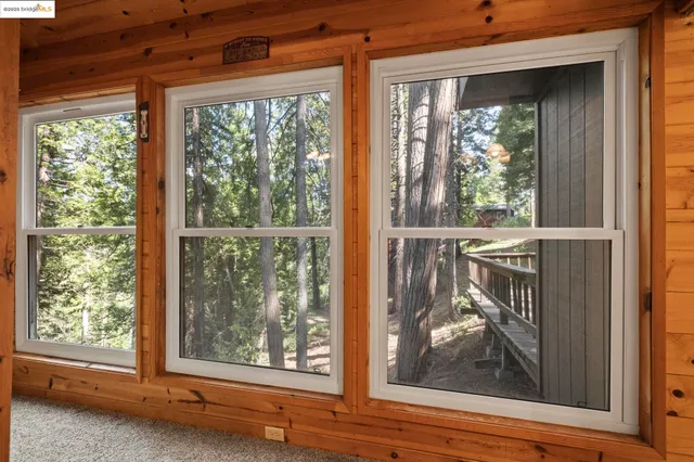 a view of a room that has a large window