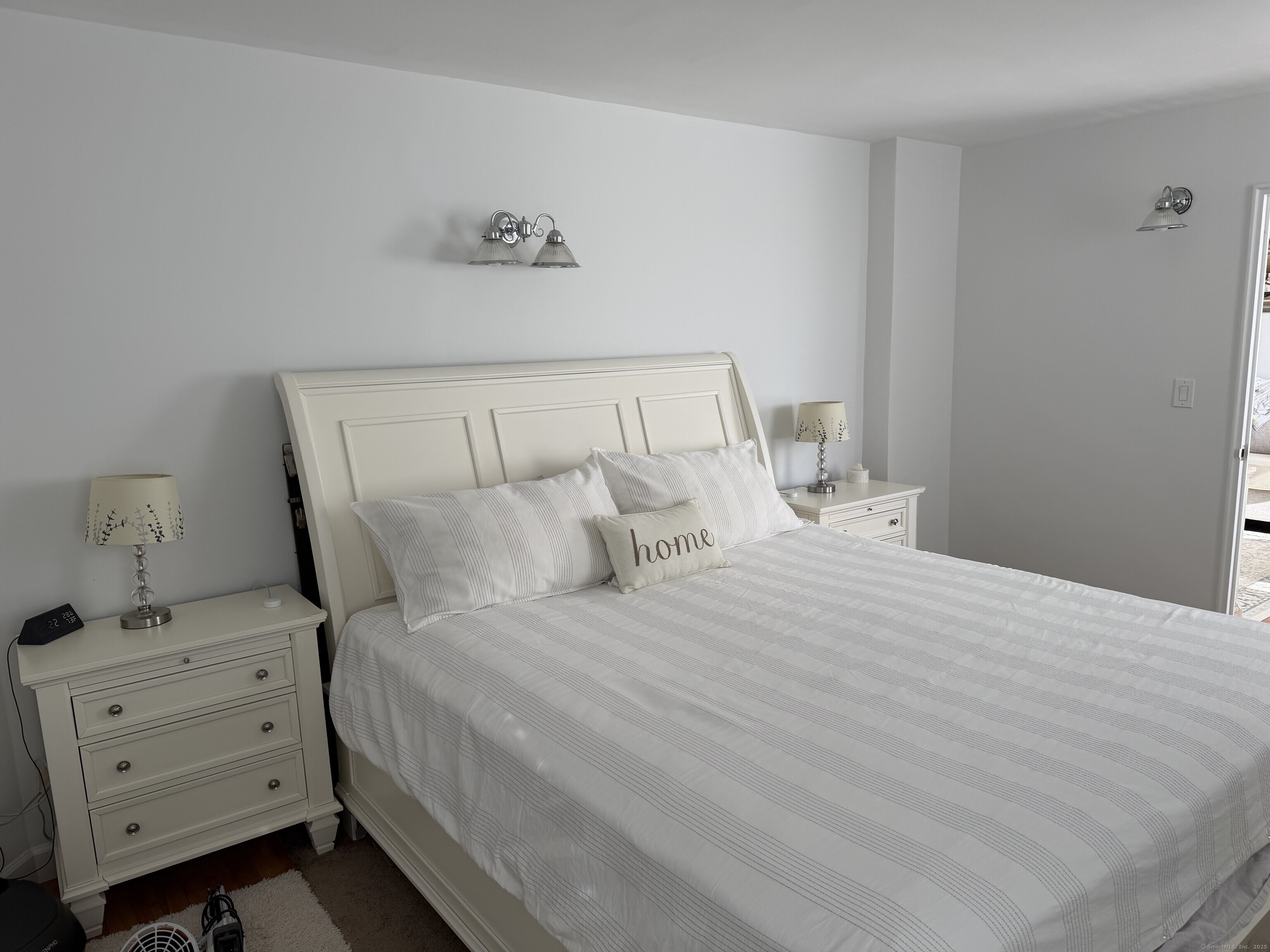 71 Strawberry Hill Avenue, Unit 305 Stamford, CT 06902 - Photo 17 of 29 a bedroom with a bed and a window