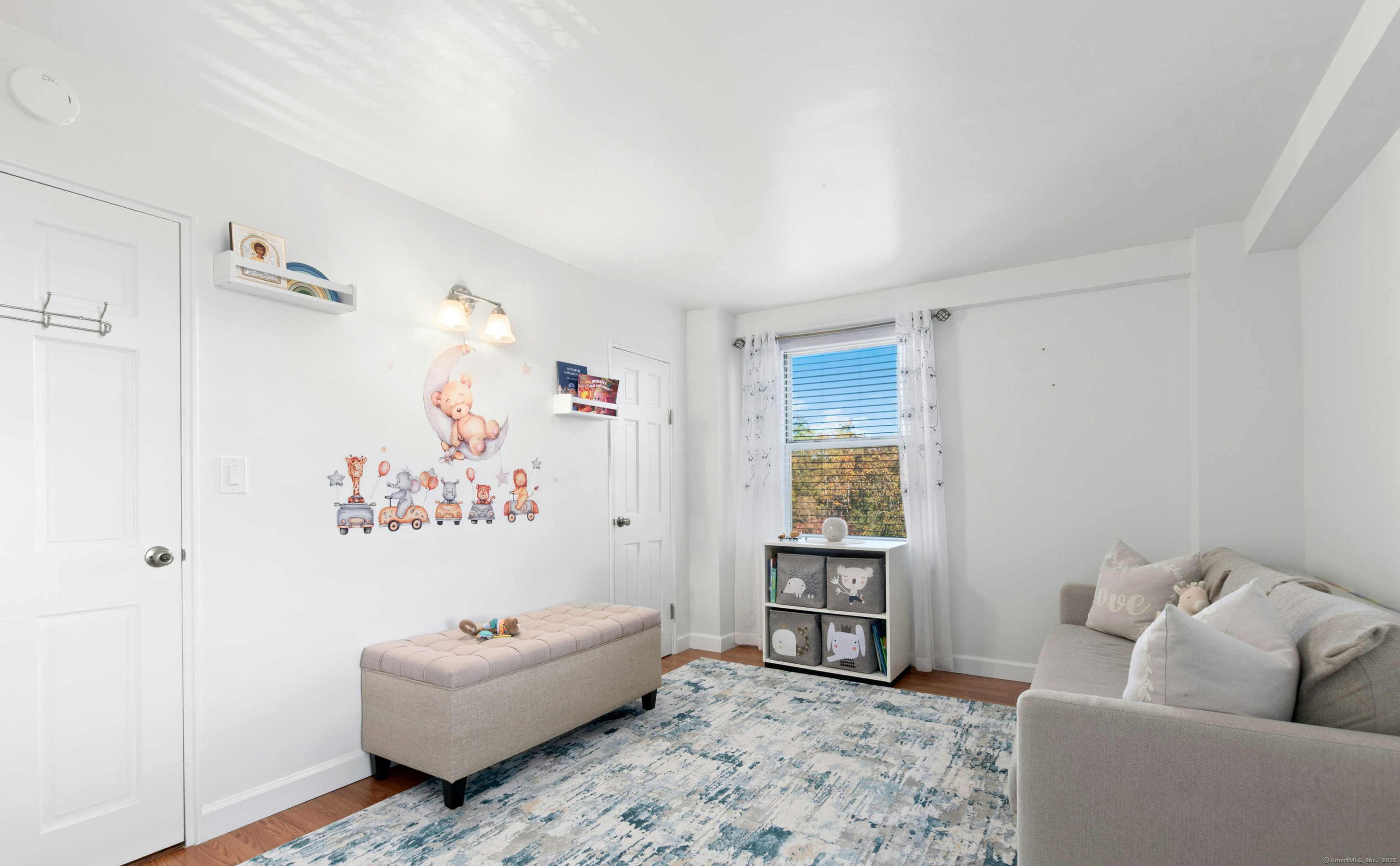 71 Strawberry Hill Avenue, Unit 305 Stamford, CT 06902 - Photo 21 of 29 a living room with furniture and a window