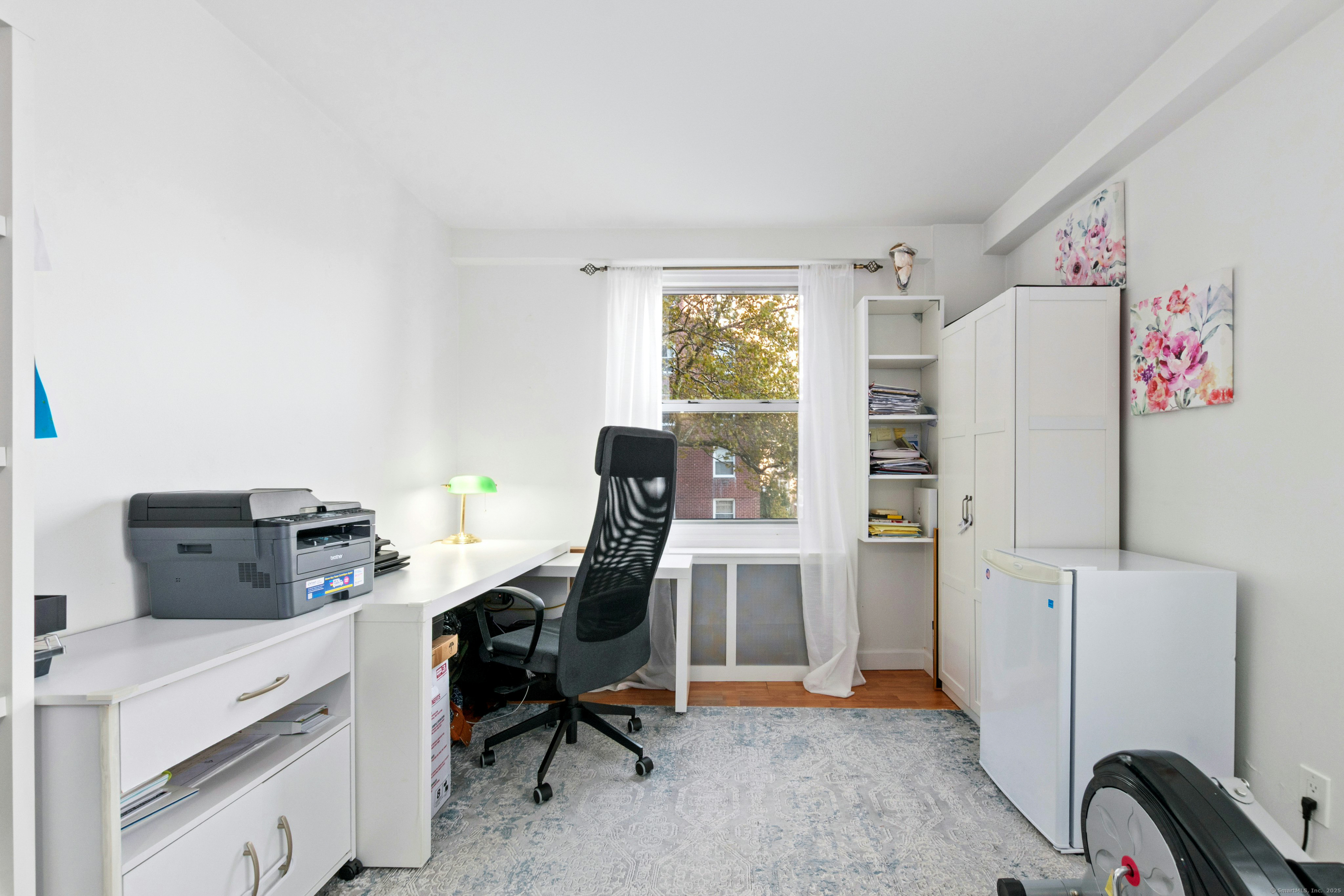 71 Strawberry Hill Avenue, Unit 305 Stamford, CT 06902 - Photo 22 of 29 a view of a workspace with furniture and a window