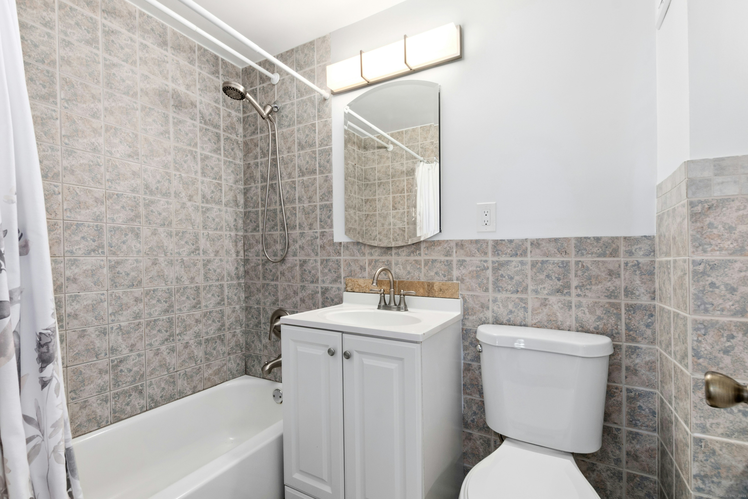 71 Strawberry Hill Avenue, Unit 305 Stamford, CT 06902 - Photo 23 of 29 a bathroom with a sink toilet and shower