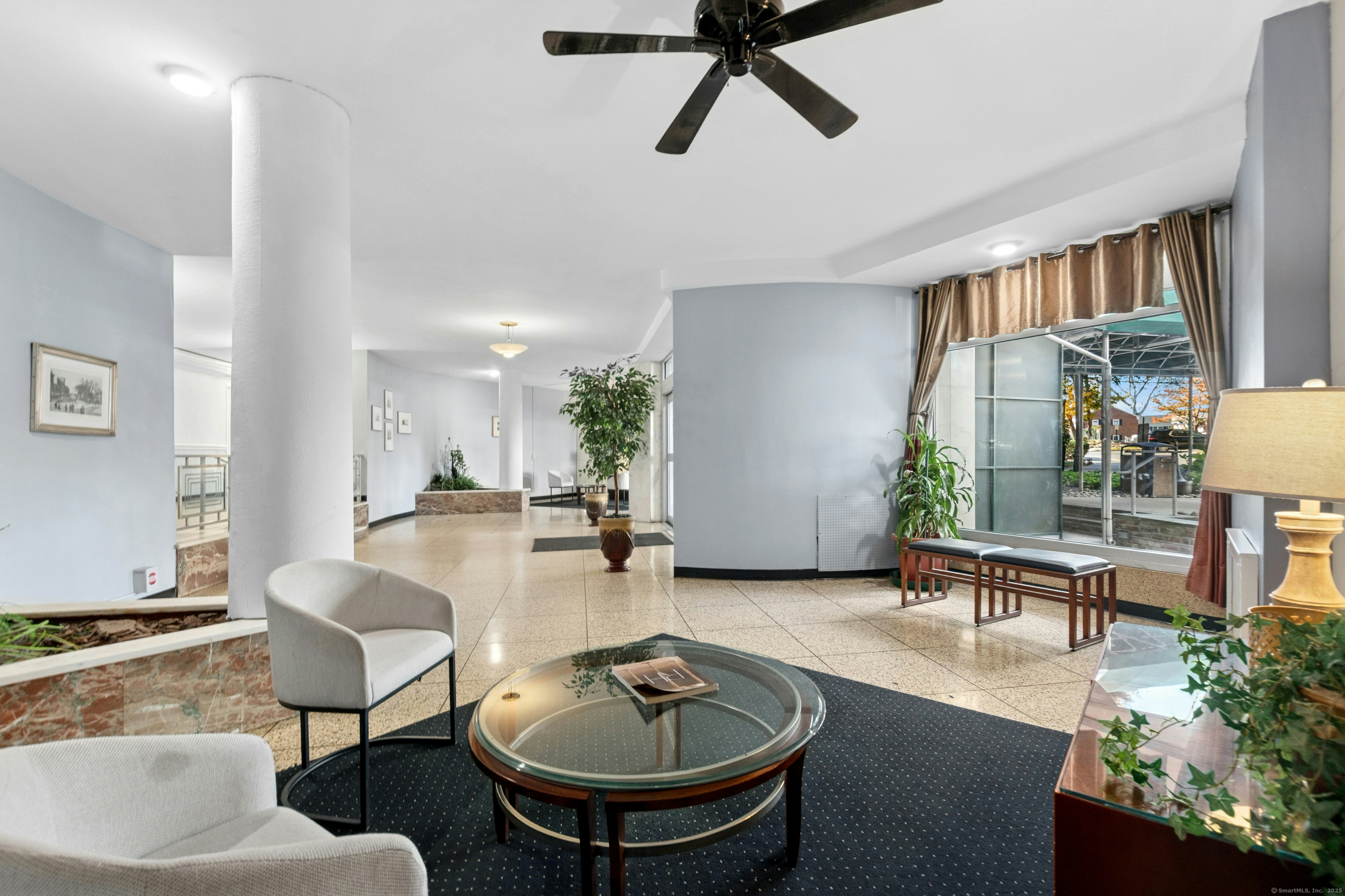 71 Strawberry Hill Avenue, Unit 305 Stamford, CT 06902 - Photo 3 of 29 a living room with furniture and a potted plant