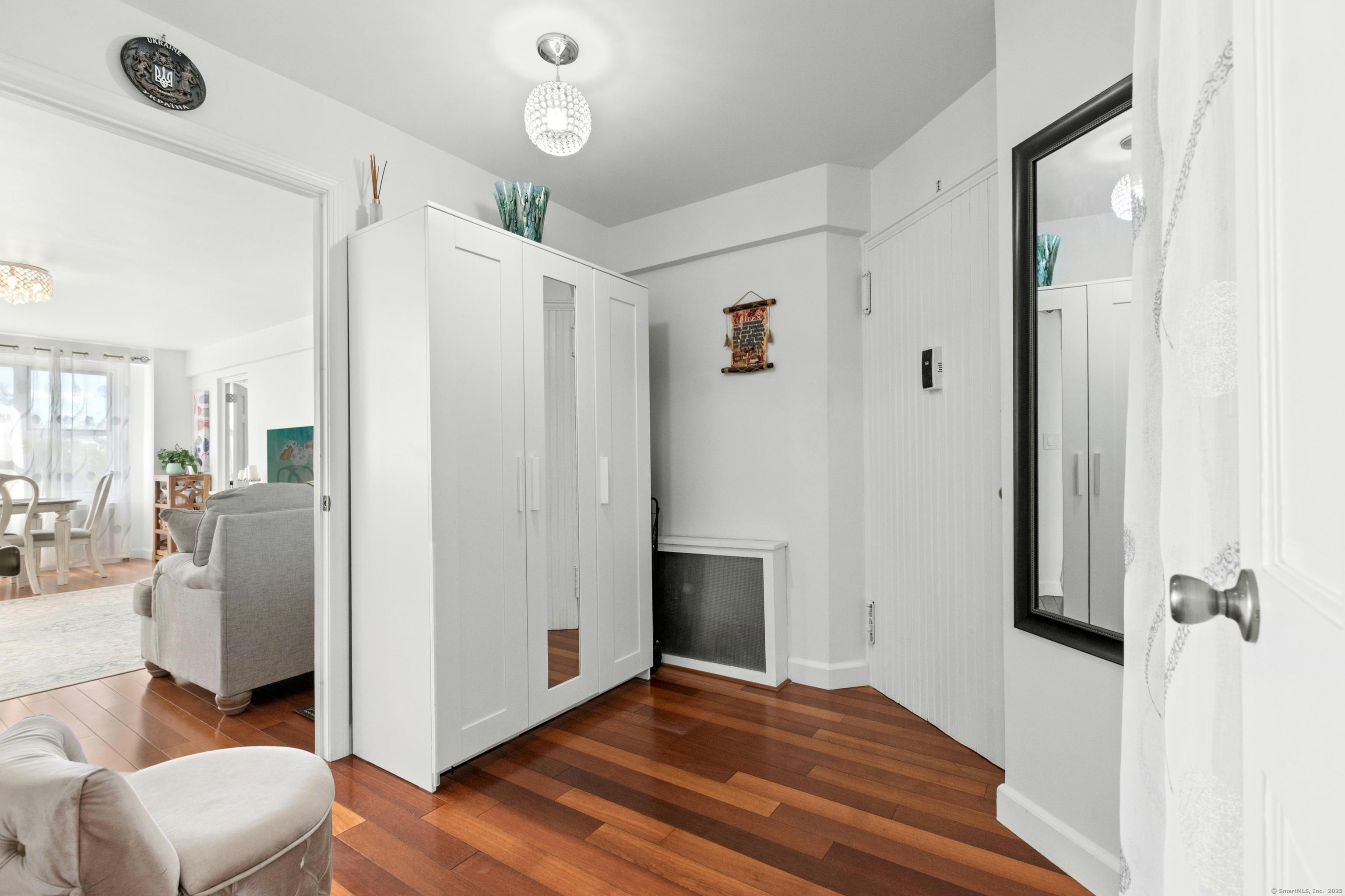 71 Strawberry Hill Avenue, Unit 305 Stamford, CT 06902 - Photo 6 of 29 a view of a hallway with bathroom and wooden floor