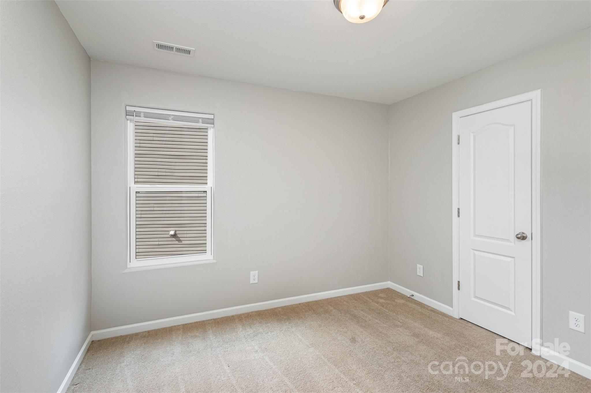 1105 Rook Road Charlotte, NC 28216 - Photo 11 of 14 an empty room with windows