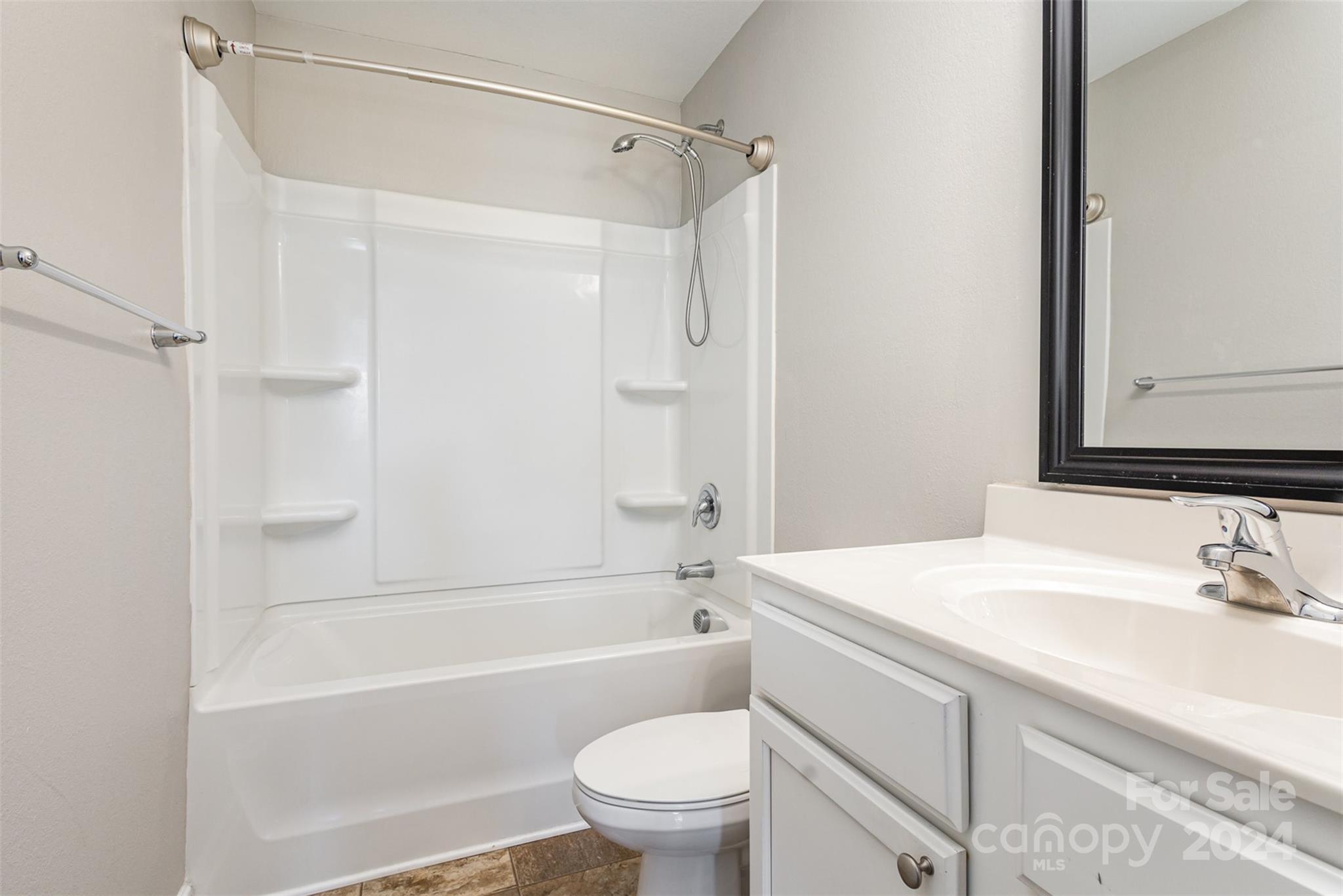 1105 Rook Road Charlotte, NC 28216 - Photo 12 of 14 a bathroom with a sink a toilet and a bathtub