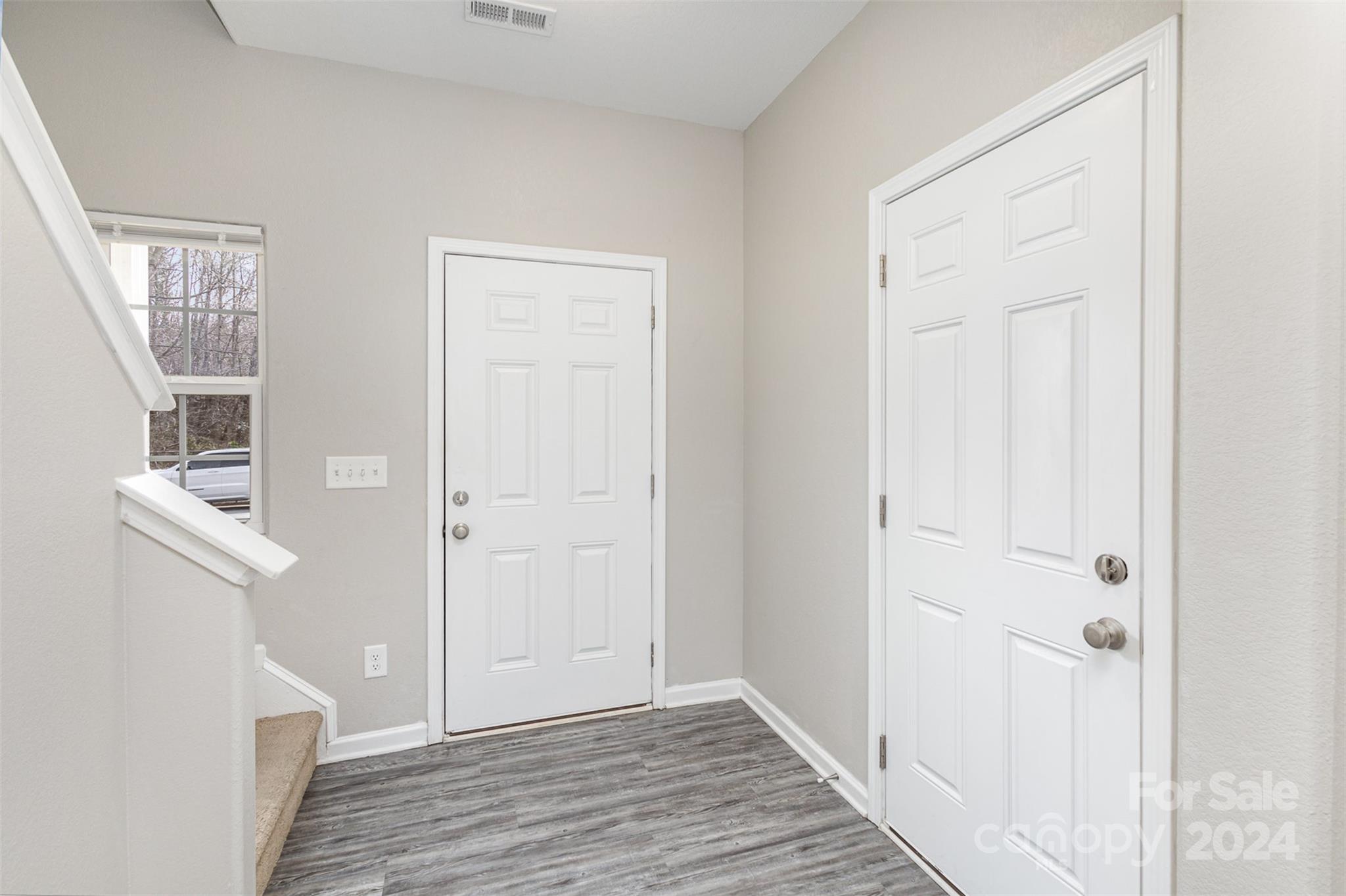 1105 Rook Road Charlotte, NC 28216 - Photo 2 of 14 a view of a hallway with wooden floor and entryway