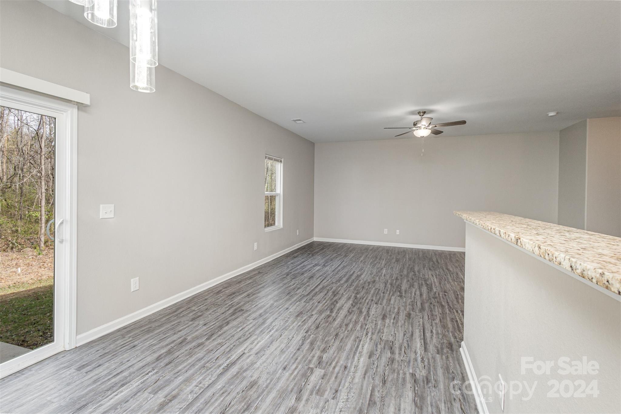 1105 Rook Road Charlotte, NC 28216 - Photo 6 of 14 wooden floor in an empty room with a window