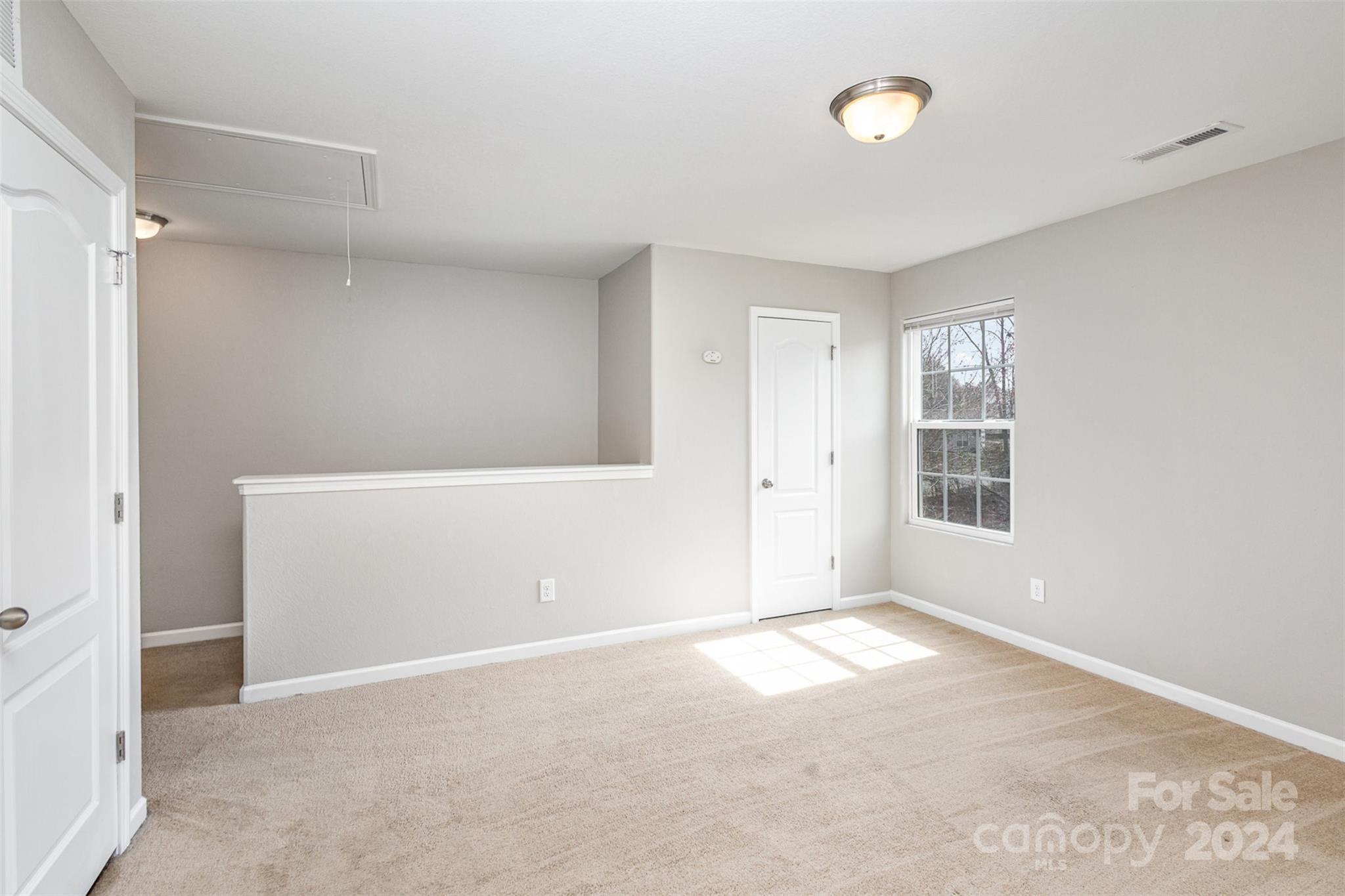1105 Rook Road Charlotte, NC 28216 - Photo 7 of 14 a view of an empty room with a window
