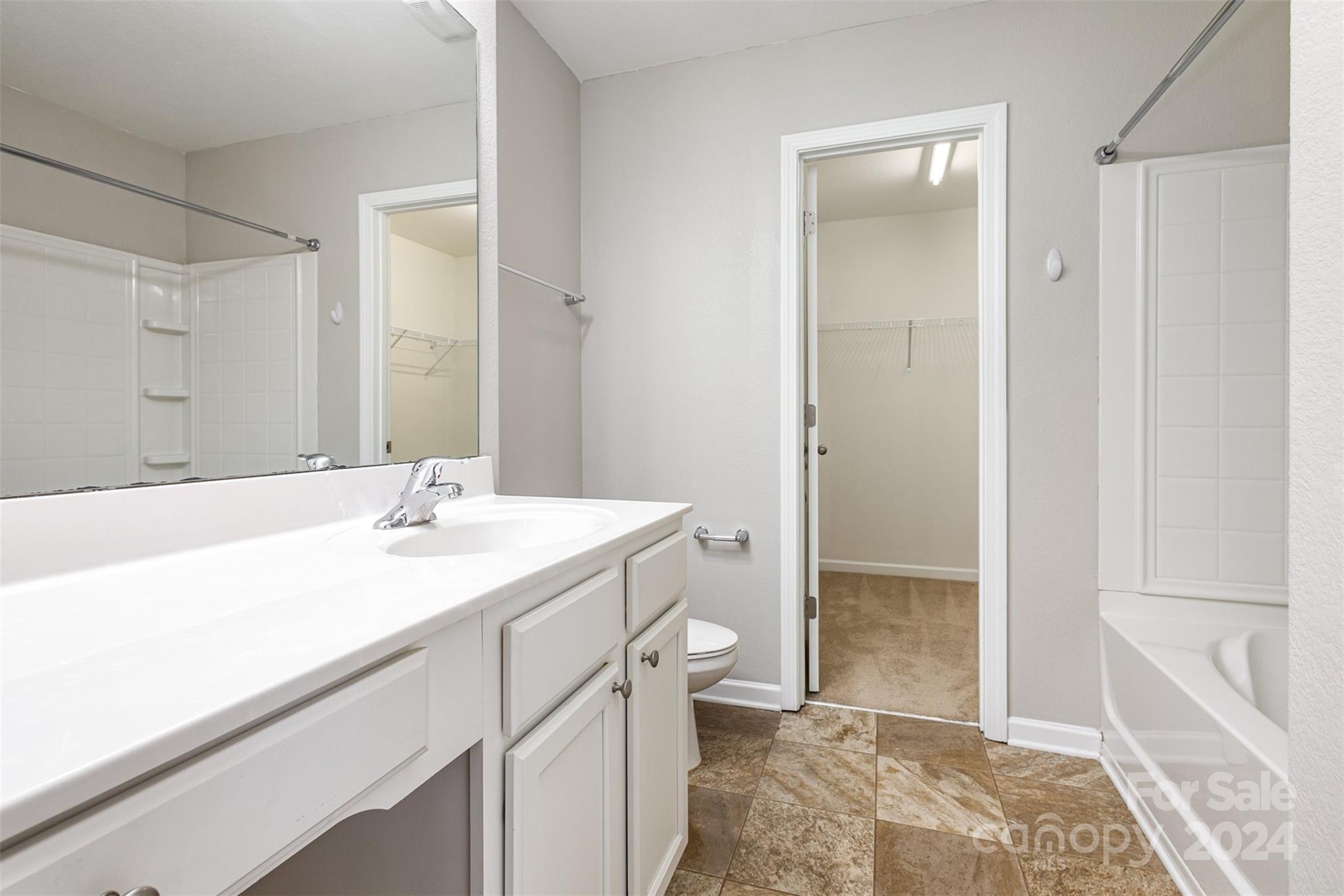 1105 Rook Road Charlotte, NC 28216 - Photo 9 of 14 a bathroom with a sink a toilet and shower