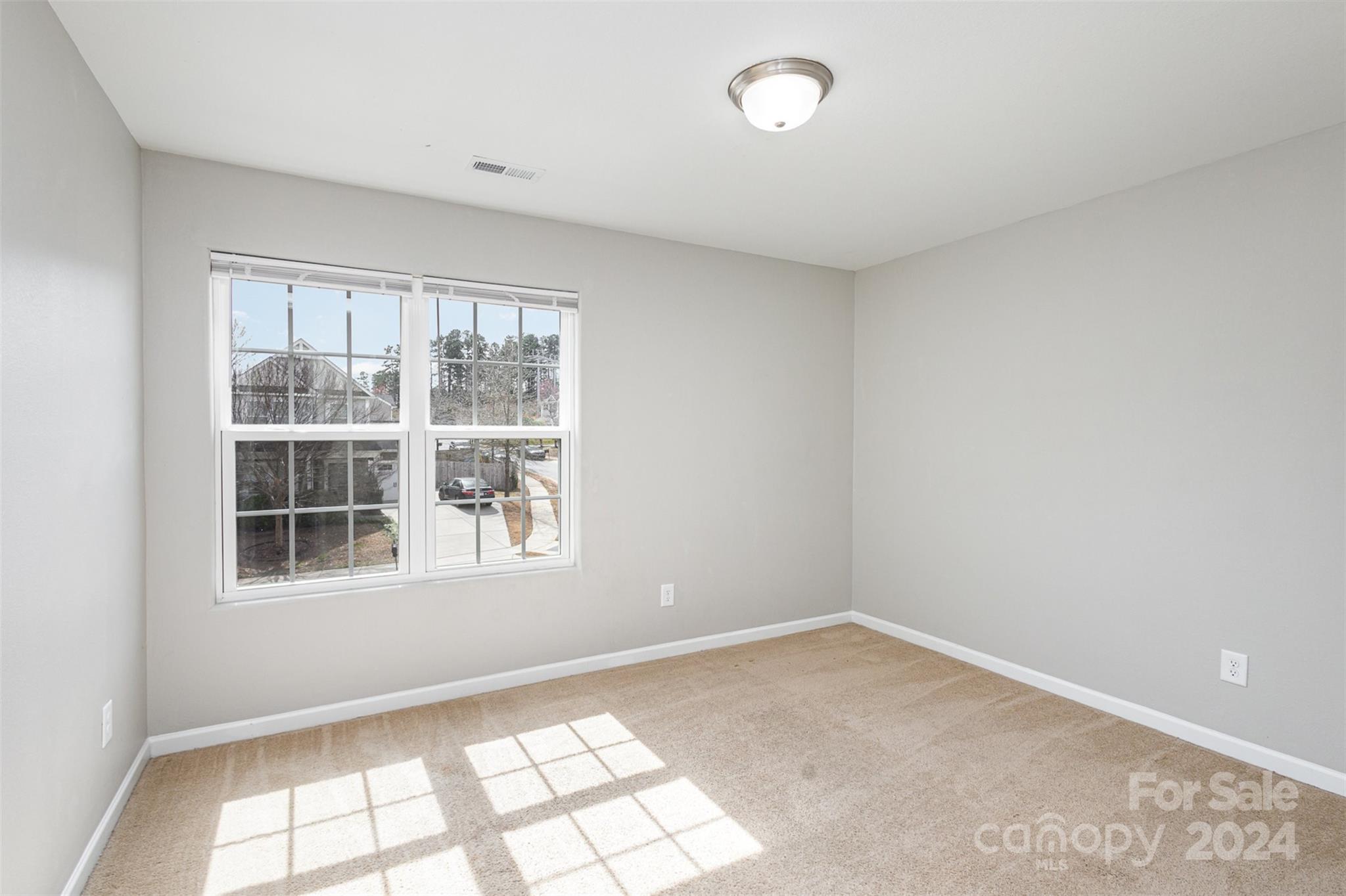 1105 Rook Road Charlotte, NC 28216 - Photo 10 of 14 an empty room with windows