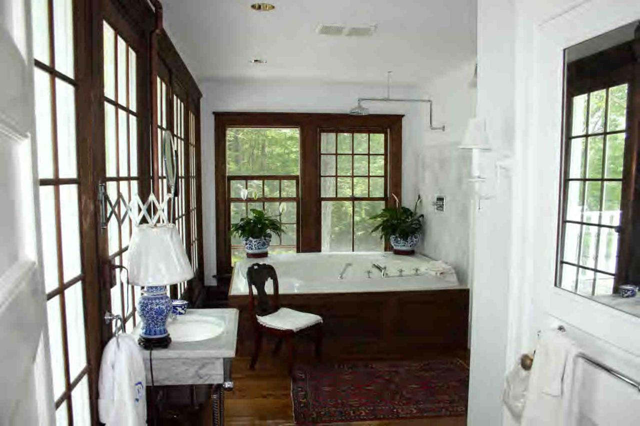 48 Tyringham Road Monterey, MA 01245 - Photo 6 of 8 a view of a dining room with furniture window and wooden floor