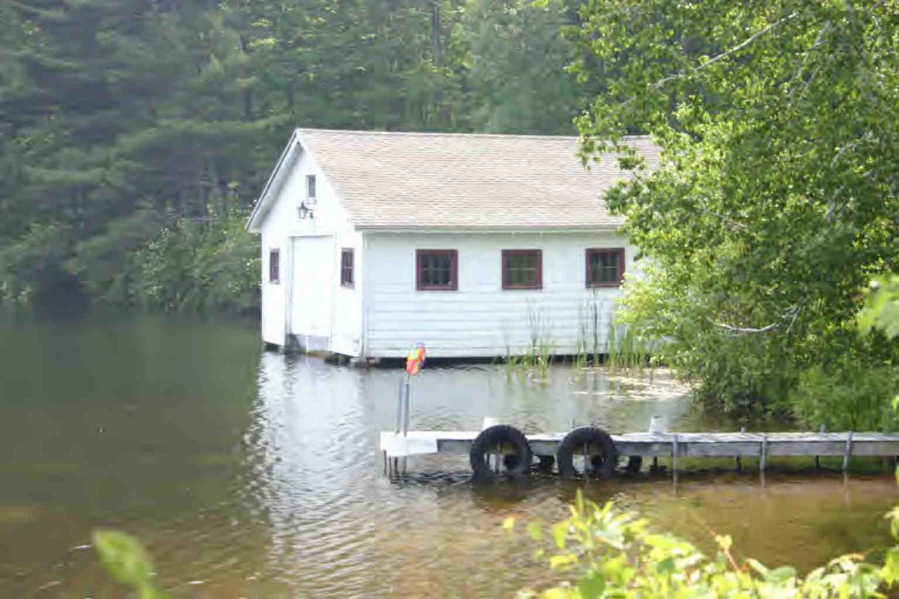 48 Tyringham Road Monterey, MA 01245 - Photo 7 of 8 a view of a house with swimming pool and a yard