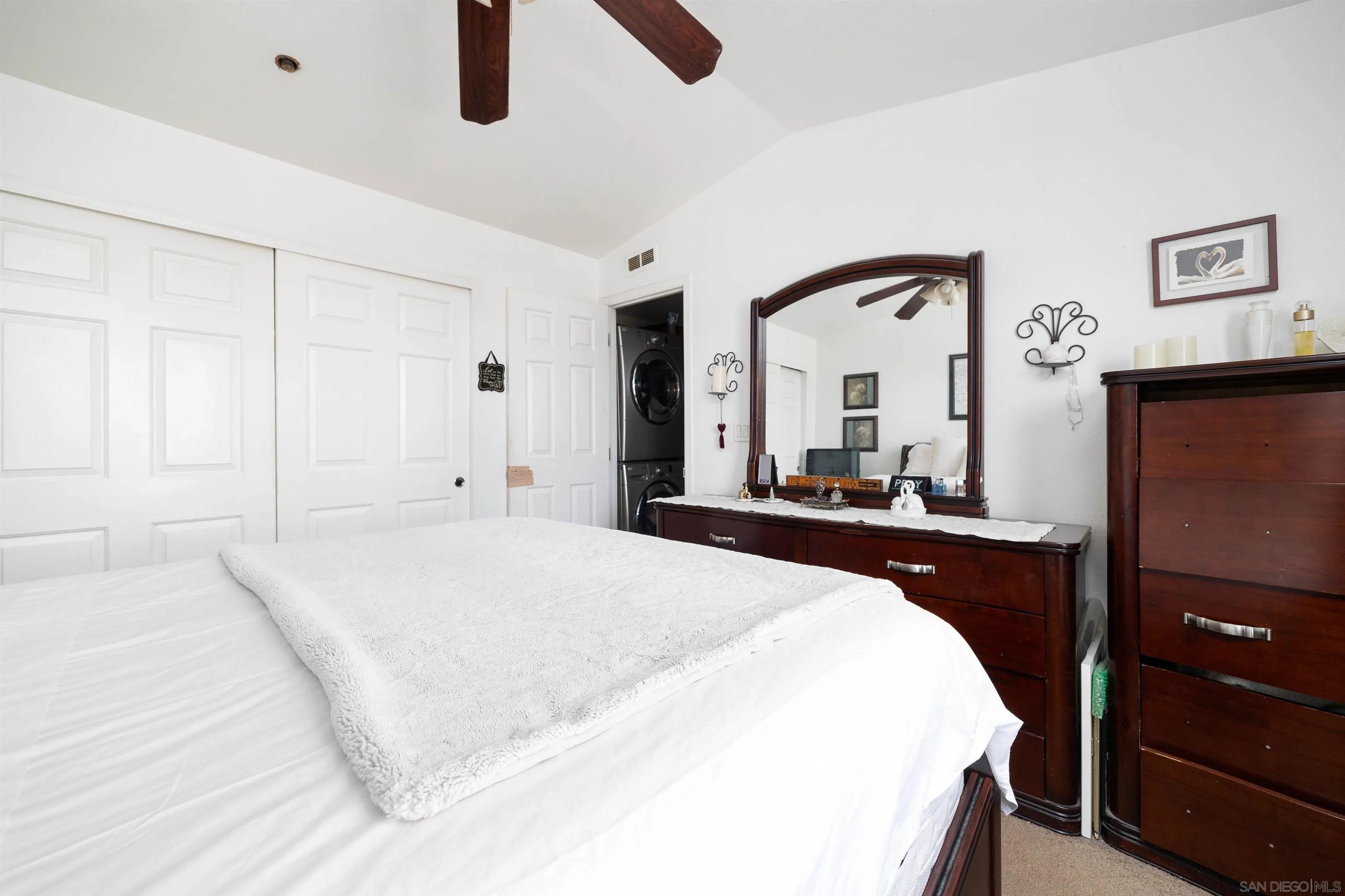 23744 Old Ranch Road Alpine, CA 91901 - Photo 12 of 17 a bedroom with a bed and a large mirror on the dresser