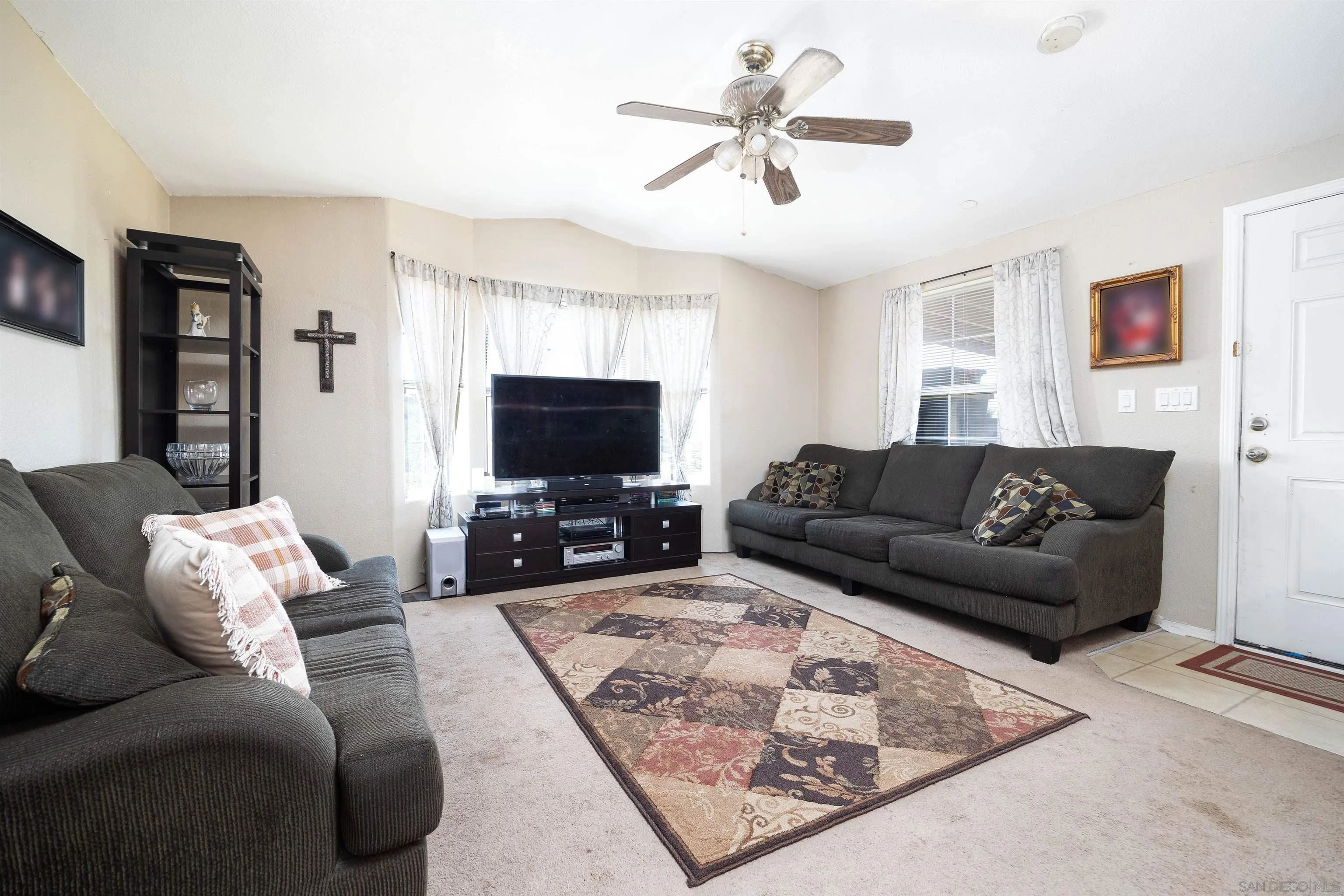 23744 Old Ranch Road Alpine, CA 91901 - Photo 5 of 17 a living room with furniture and a flat screen tv