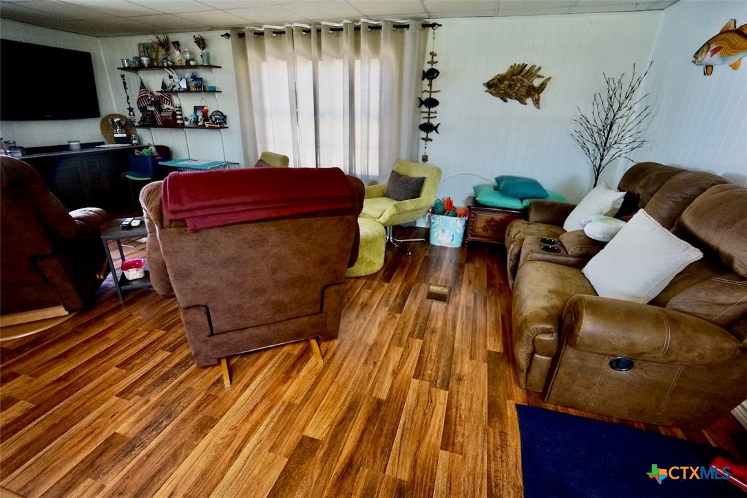 513 16th Street Port O'Connor, TX 77982 - Photo 15 of 35 a living room with furniture and wooden floor
