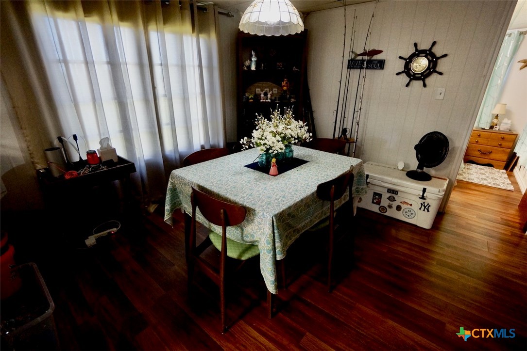 513 16th Street Port O'Connor, TX 77982 - Photo 19 of 35 a dining room with furniture and wooden floor