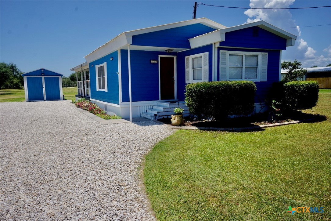 513 16th Street Port O'Connor, TX 77982 - Photo 2 of 35 a front view of a house with a yard
