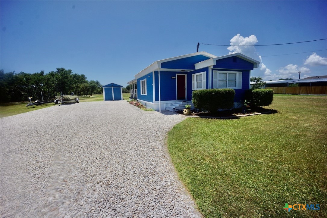 513 16th Street Port O'Connor, TX 77982 - Photo 3 of 35 a front view of a house with a yard