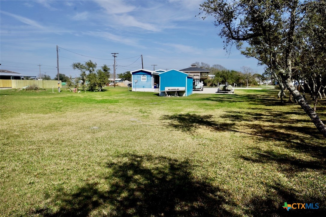 513 16th Street Port O'Connor, TX 77982 - Photo 31 of 35 a swimming pool with yard