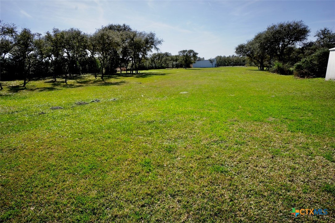 513 16th Street Port O'Connor, TX 77982 - Photo 32 of 35 a view of field with trees in the background