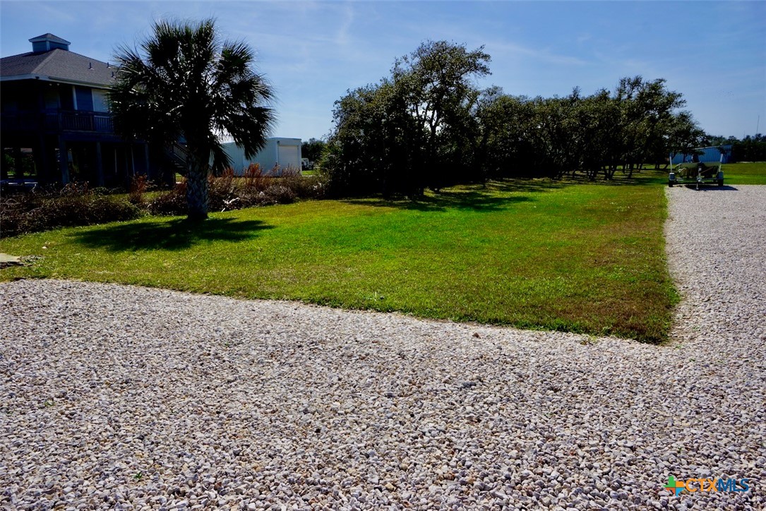 513 16th Street Port O'Connor, TX 77982 - Photo 35 of 35 a backyard of a house with lots of green space