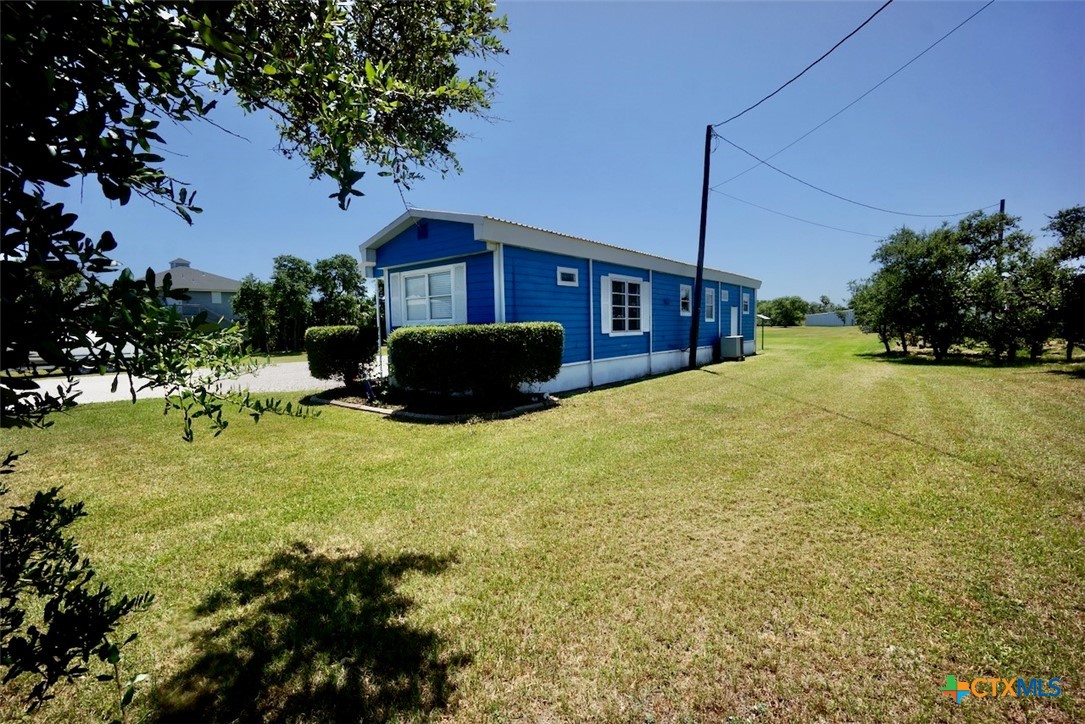 513 16th Street Port O'Connor, TX 77982 - Photo 4 of 35 a view of a house with a yard