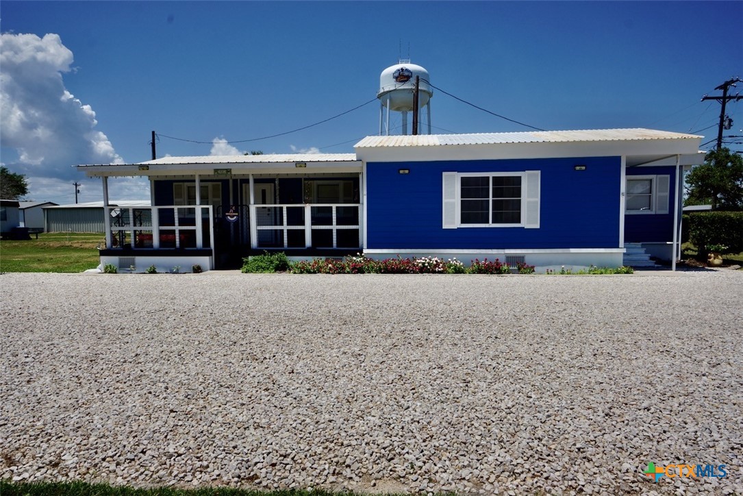 513 16th Street Port O'Connor, TX 77982 - Photo 6 of 35 a front view of a house with a yard