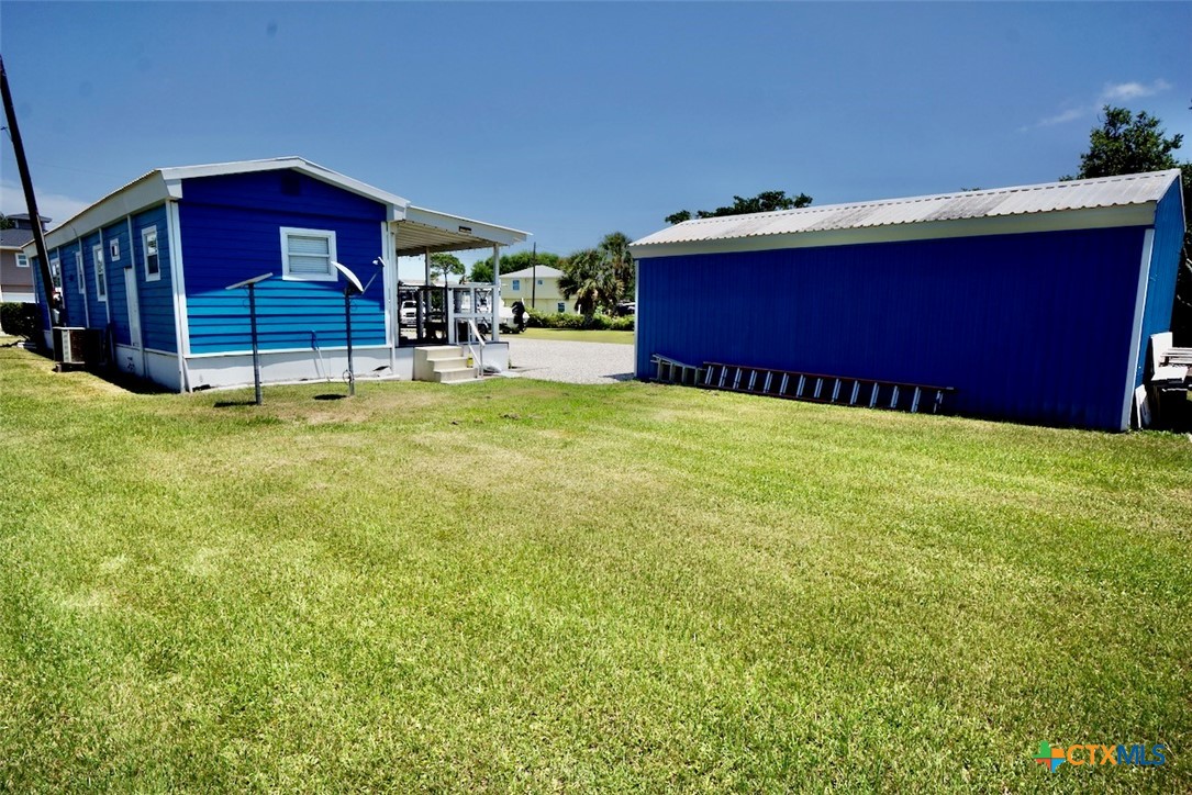 513 16th Street Port O'Connor, TX 77982 - Photo 7 of 35 a view of a yard with a house