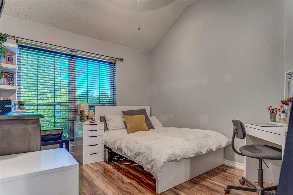 11812 Canoe Road Frisco, TX 75035 - Photo 23 of 31 a bedroom with a bed and large windows