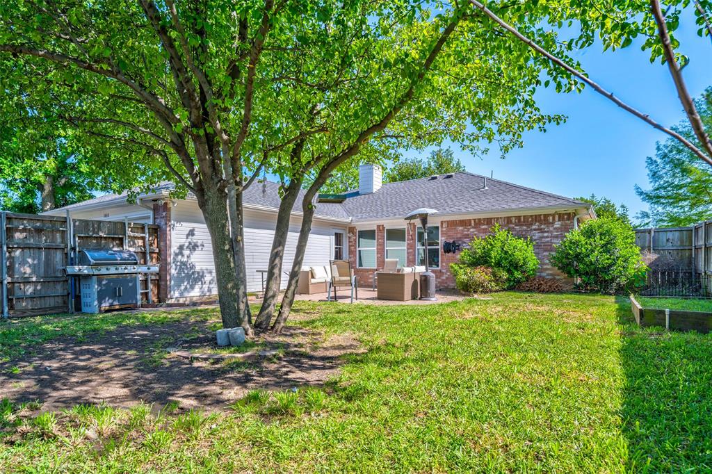 11812 Canoe Road Frisco, TX 75035 - Photo 30 of 31 a view of a house with a yard