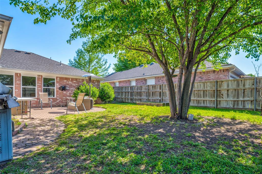 11812 Canoe Road Frisco, TX 75035 - Photo 31 of 31 a view of a house with backyard and sitting area