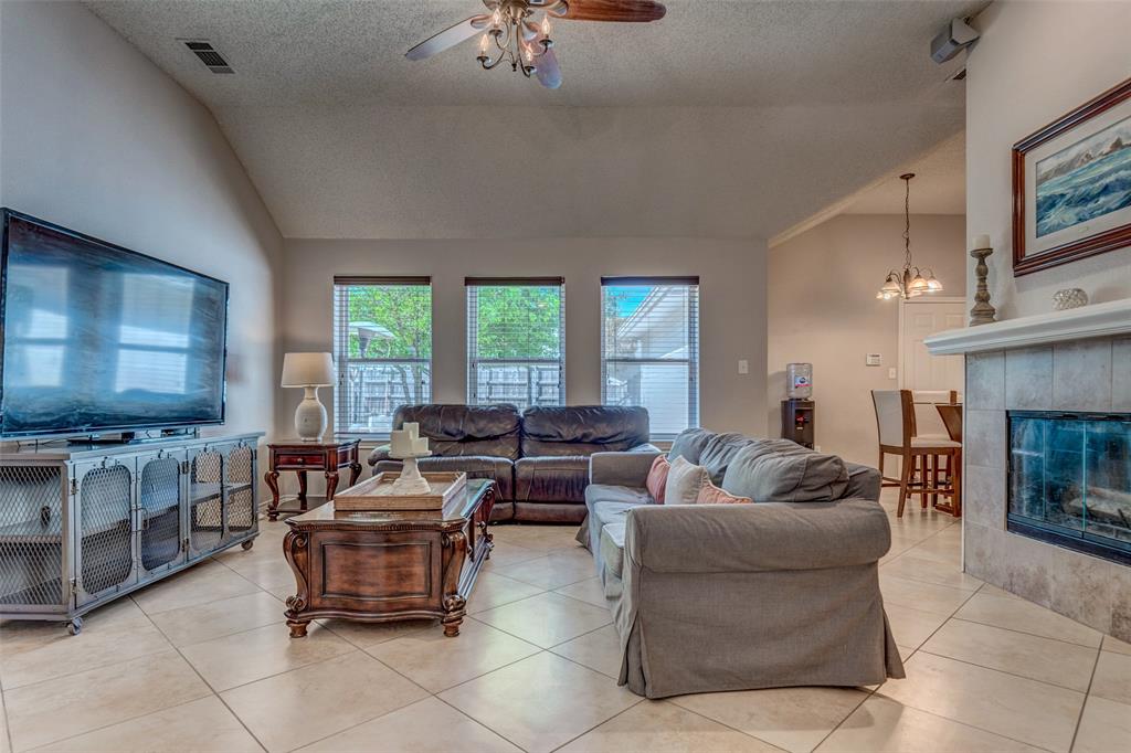 11812 Canoe Road Frisco, TX 75035 - Photo 10 of 31 a living room with furniture and a flat screen tv