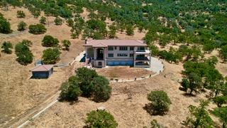 15169 Moccasin Ranch Road Coulterville, CA 95311 - Photo 15 of 15 a view of a house with a yard