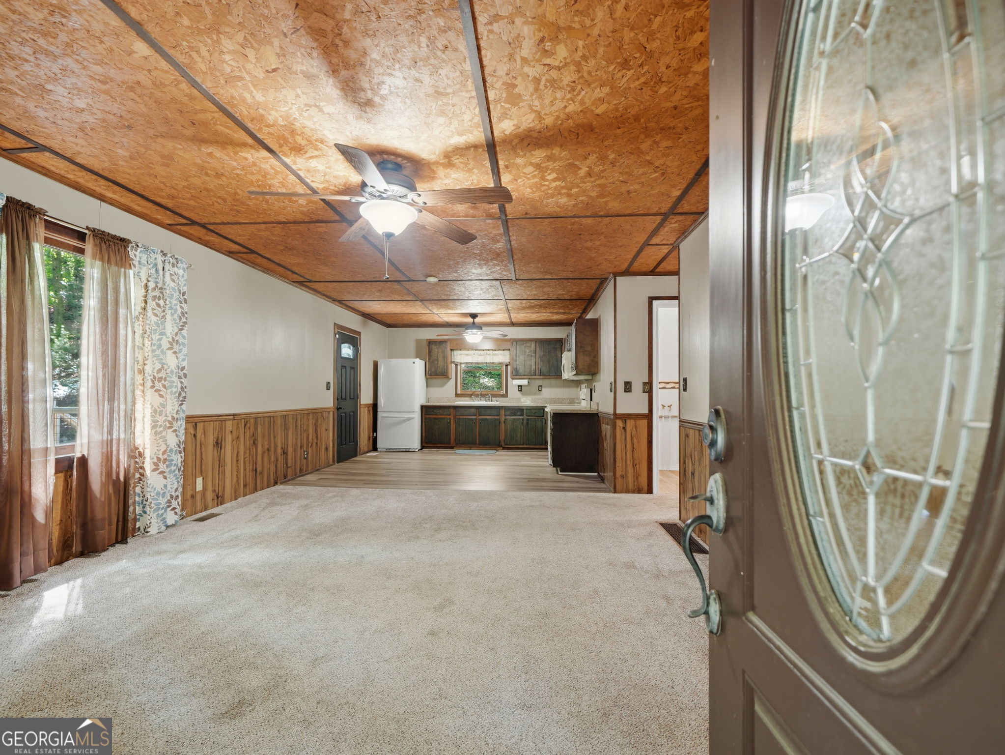 629 Goose Island Road Cherry Log, GA 30522 - Photo 6 of 52 a view of a hallway with a refrigerator