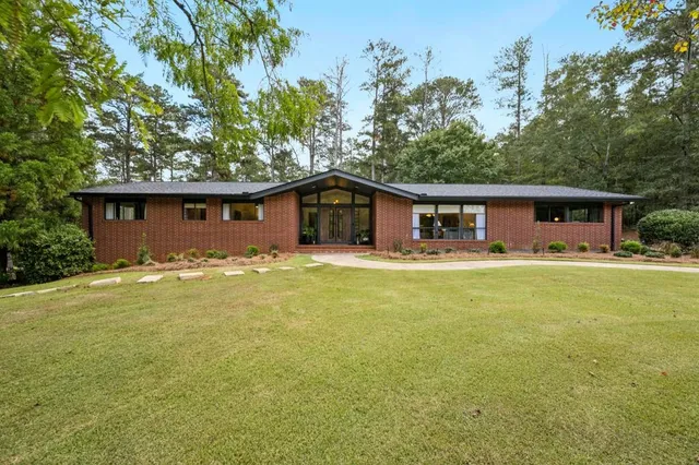 a front view of a house with swimming pool