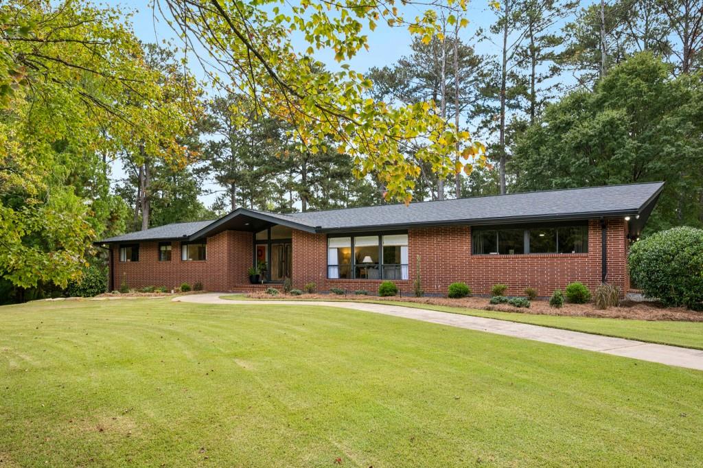 334 Luther Bailey Road Senoia, GA 30276 - Photo 13 of 67 a front view of a house with a yard