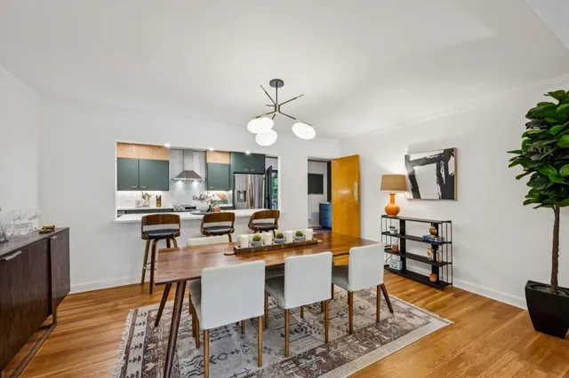 a kitchen with stainless steel appliances kitchen island granite countertop a sink window and cabinets