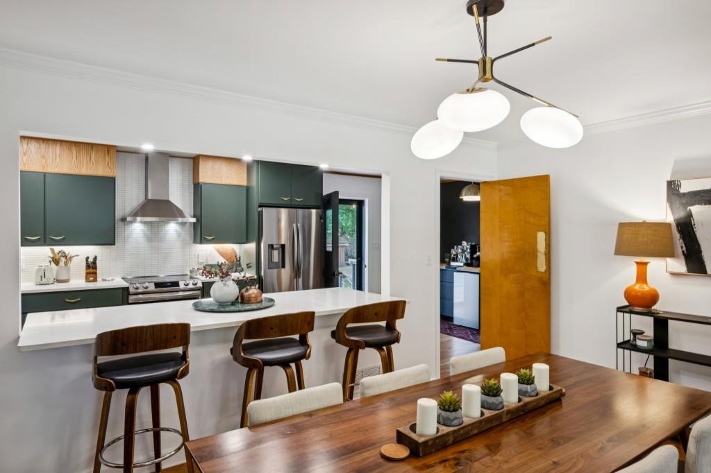 334 Luther Bailey Road Senoia, GA 30276 - Photo 25 of 67 a view of a dining room with furniture and wooden floor