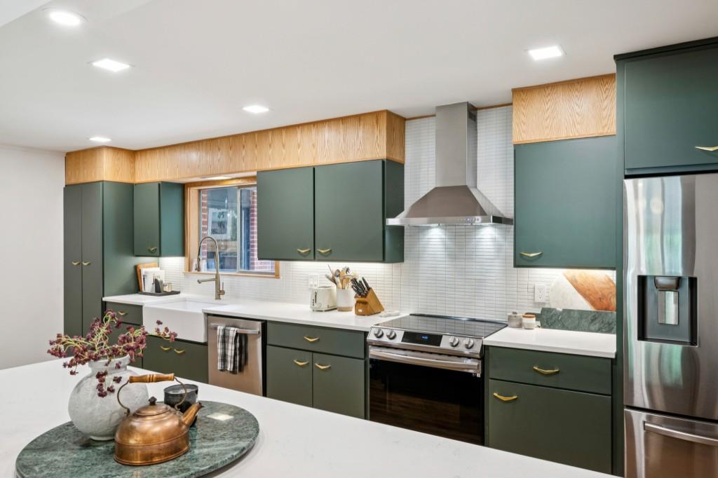 334 Luther Bailey Road Senoia, GA 30276 - Photo 27 of 67 a kitchen with a sink stove and cabinets