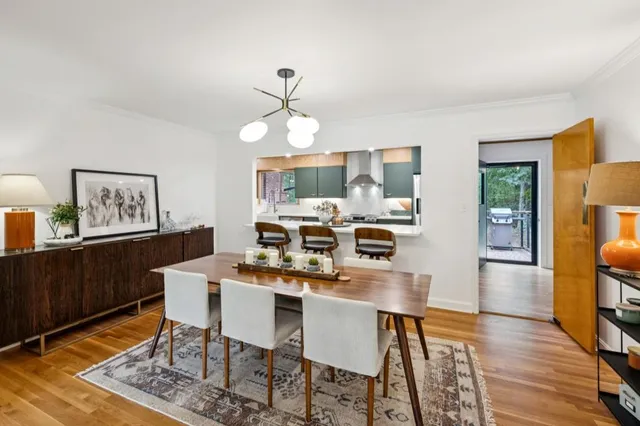a view of a dining room with furniture wooden floor and a rug