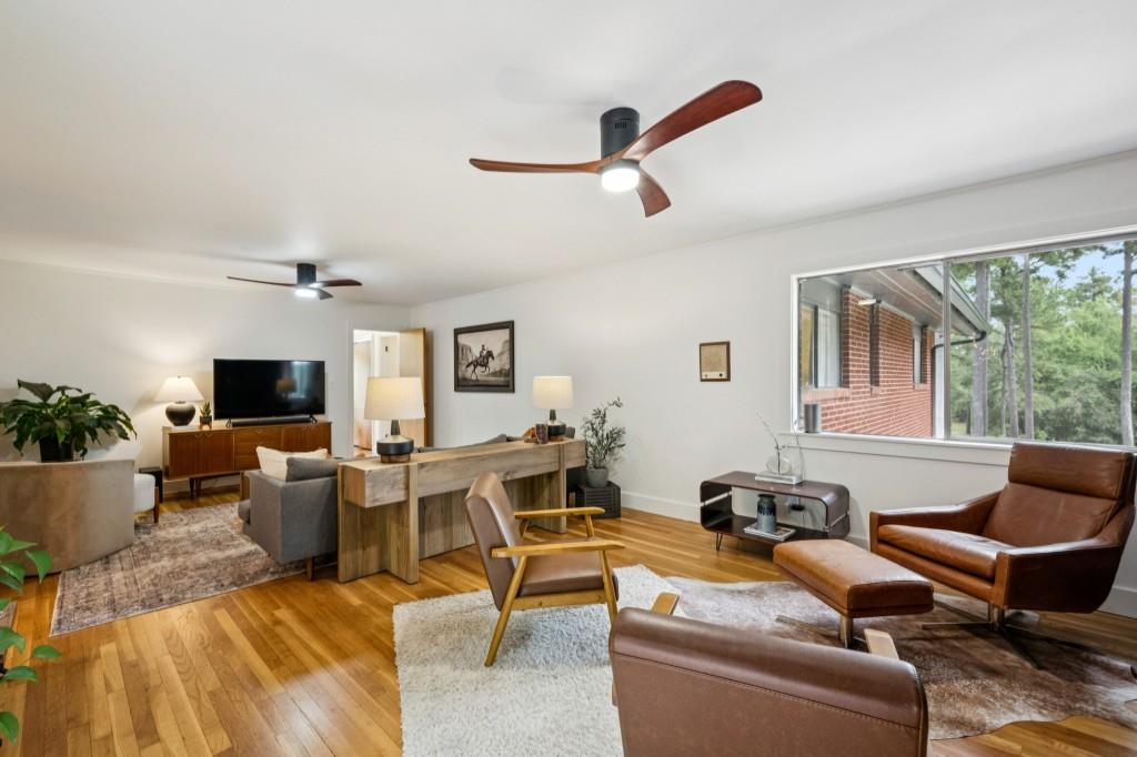 334 Luther Bailey Road Senoia, GA 30276 - Photo 36 of 67 a living room with furniture and a flat screen tv