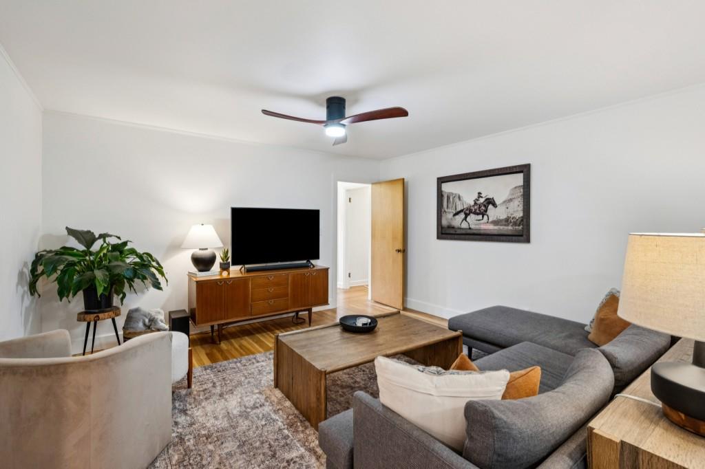 334 Luther Bailey Road Senoia, GA 30276 - Photo 37 of 67 a living room with furniture and a flat screen tv