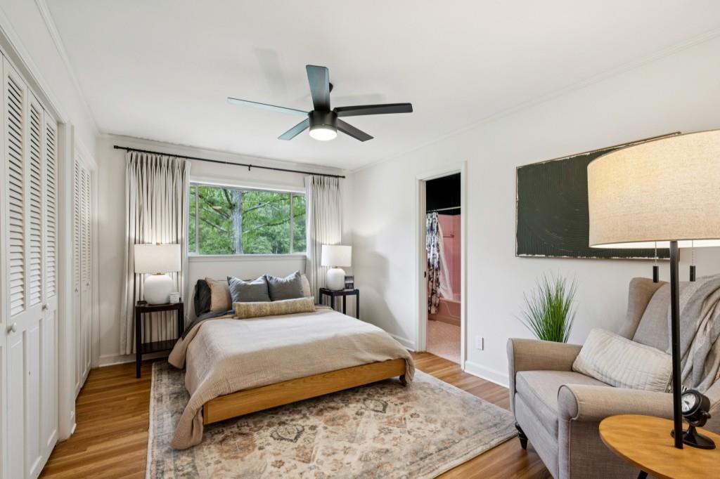 334 Luther Bailey Road Senoia, GA 30276 - Photo 43 of 67 a bedroom with a large bed couch and a window