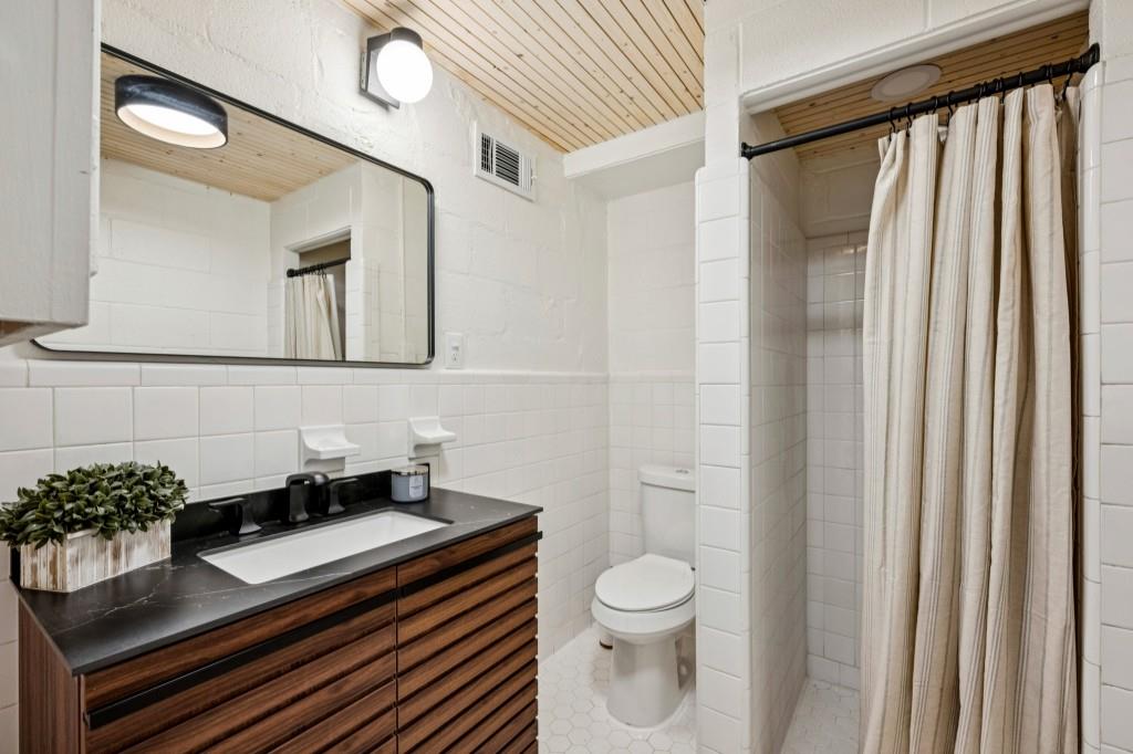 334 Luther Bailey Road Senoia, GA 30276 - Photo 49 of 67 a bathroom with a sink a toilet and shower