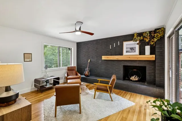 a living room with furniture and a fireplace