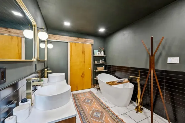 a bathroom with a sink mirror vanity and toilet