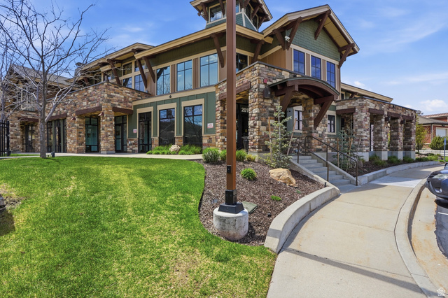2007 Fielding Hill Lane Draper, UT 84020 - Photo 53 of 83 Stone and wood-finish exterior with large windows, a prominent entryway, and a manicured lawn