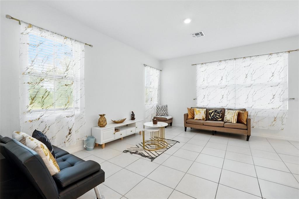 1421 Discovery Street Davenport, FL 33896 - Photo 15 of 44 a living room with furniture and a window