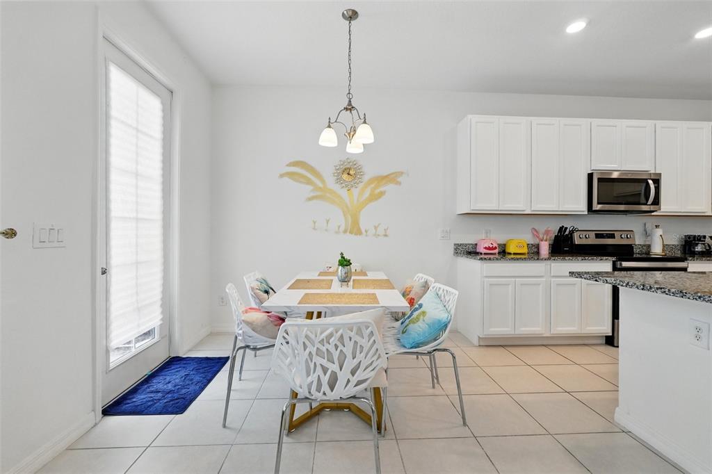 1421 Discovery Street Davenport, FL 33896 - Photo 19 of 44 a kitchen with a sink cabinets and window