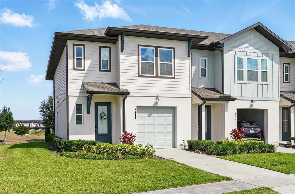 1421 Discovery Street Davenport, FL 33896 - Photo 2 of 44 a front view of a house with garden